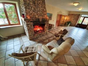 an overhead view of a living room with a stone fireplace at Bille in Bille