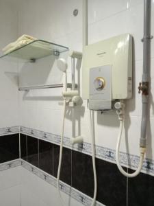 a room with a hair dryer in a bathroom at Glory Beach Resort PriVate PentHouse in Port Dickson
