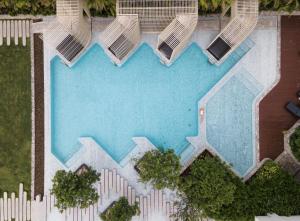 an overhead view of a swimming pool at a resort at Veranda Residence by GoldStar Group in Jomtien Beach
