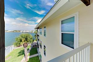 a balcony view of the ocean from a house at Sand Dollar Unit C3 in Rockport