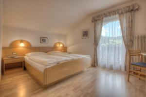 Postel nebo postele na pokoji v ubytování Garni Oskar Appartments