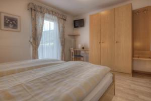 Postel nebo postele na pokoji v ubytování Garni Oskar Appartments