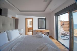 Posteľ alebo postele v izbe v ubytovaní Villa Gina by Elounda Island View Villas