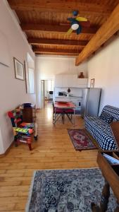 a living room with a couch and a table at Appartamento il Palazzone in Capraia