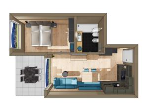 a floor plan of a living room with blue furniture at Rienz Alpine City Lofts in Brunico