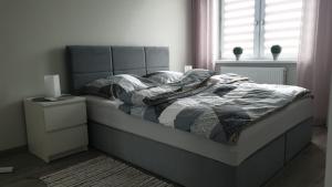 Ένα ή περισσότερα κρεβάτια σε δωμάτιο στο Apartament STYL