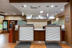 a lobby of a store with a counter at Comfort Inn Binghamton I-81 in Binghamton