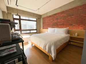 Katil atau katil-katil dalam bilik di 鬧鐘關掉旅店 Alarm Off B&B