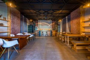 a restaurant with tables and chairs and a bar at Gudauri Cozy Home in Gudauri