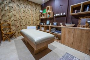 a room with a bench in a room with a counter at Gudauri Cozy Home in Gudauri