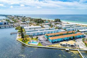 an aerial view of a resort next to the ocean at Anna Maria Island Beach Sands 203 in Bradenton Beach