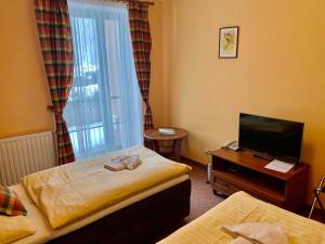 Krevet ili kreveti u jedinici u okviru objekta Hotel Loucky