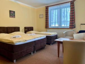 Krevet ili kreveti u jedinici u okviru objekta Hotel Loucky