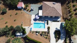 an overhead view of a house with a swimming pool at Pomos Idol Exceptional Beach Villa in Pomos