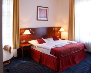 Letto o letti in una camera di Hotel Grand