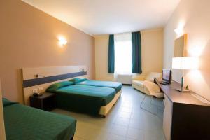 Postel nebo postele na pokoji v ubytování Hotel Alba Roma
