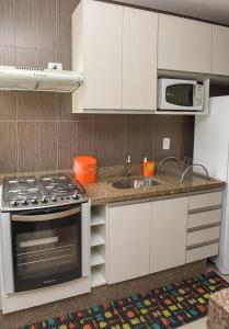 
A cozinha ou cozinha compacta de Residencial Flat Villa Rosa
