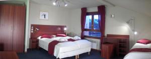 Postel nebo postele na pokoji v ubytování Hotel Chalet du Crey + 37 fotografií