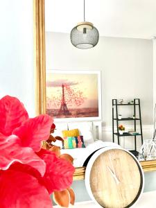 a bedroom with a bed and a mirror at Arina & Julien Dieppe in Dieppe