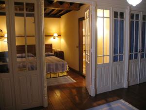 A bed or beds in a room at Casa de Campoo