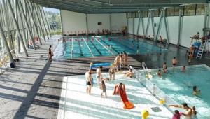 a group of people in a swimming pool at Elegant historic apartment Le Mont Joly - 3 bed 2bath view 80m2 in Saint-Gervais-les-Bains