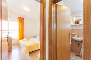 Posteľ alebo postele v izbe v ubytovaní Apartman Prlić 3