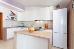 Kuchyňa alebo kuchynka v ubytovaní Apartman Prlić 3