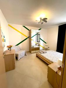 a room with two beds and a mirror at Casa Serra in Porto Palo