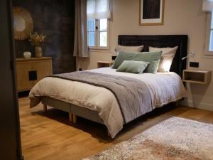 Cama o camas de una habitación en Le Lavoir des Capucins