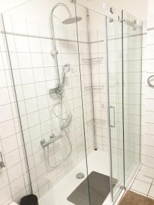 a shower with a glass enclosure in a bathroom at Ferienwohnung Calabria Nr 2 in Mülheim an der Ruhr