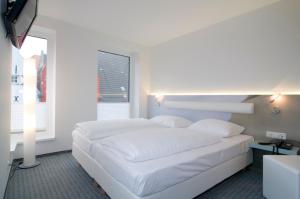 Postel nebo postele na pokoji v ubytování Hotel New Orleans