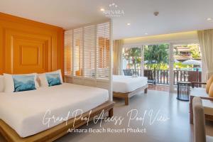 Postel nebo postele na pokoji v ubytování Arinara Beach Resort Phuket - SHA Extra Plus