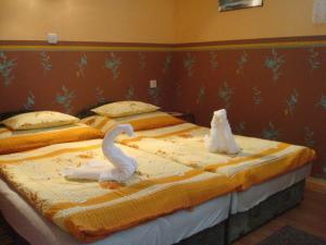 Postelja oz. postelje v sobi nastanitve Budai Apartmanház