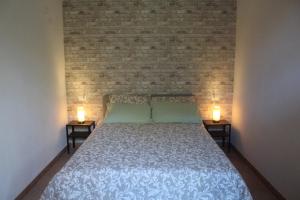 Postel nebo postele na pokoji v ubytování Agriturismo Podere I' Caldino