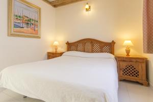 Postel nebo postele na pokoji v ubytování Sands Beach Active Resort
