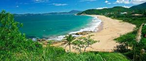 a view of a beach with the ocean at Pousada Bella Nina in Balneário Camboriú