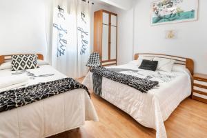 Posteľ alebo postele v izbe v ubytovaní Hostal "Los Chanos el Ruso"