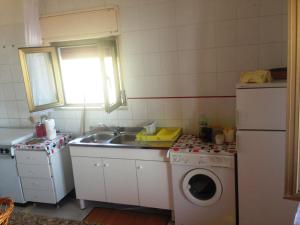A kitchen or kitchenette at Fronte del Porto