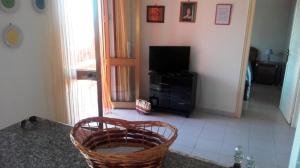 A television and/or entertainment centre at Fronte del Porto