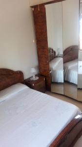 A bed or beds in a room at Fronte del Porto
