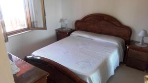 A bed or beds in a room at Fronte del Porto