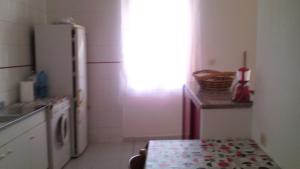 A kitchen or kitchenette at Fronte del Porto