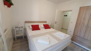 Postel nebo postele na pokoji v ubytování Apartments Jadranka
