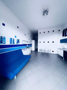 a large room with a ping pong table in it at Casa Serra in Porto Palo