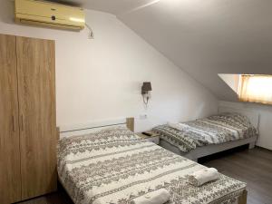 Ένα ή περισσότερα κρεβάτια σε δωμάτιο στο Samuil Apartments - Central Burgas