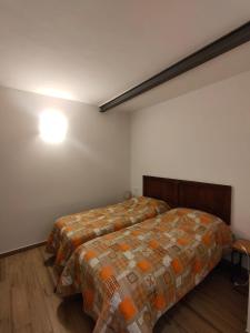 Ein Bett oder Betten in einem Zimmer der Unterkunft CASA LA FALEGNAMERIA