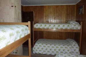 Ένα ή περισσότερα κρεβάτια σε δωμάτιο στο Hostel Danicar Puerto Natales