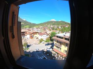 a view of a city from a window at La Fata Apartment 180mq in Moena