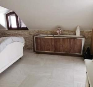 a bedroom with a bed and a sink in it at Residence Villa candida in Giardini Naxos +39 photos
