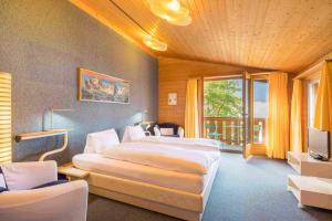 Katil atau katil-katil dalam bilik di Hotel Lindenhof by Crossworld AG